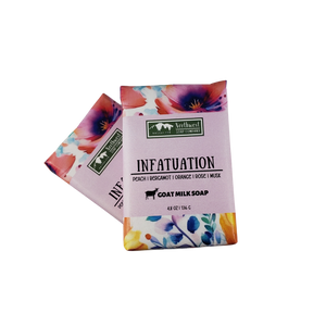NW Soap Infatuation bars wrapped in custom paper with large pink, red, purple flowers.