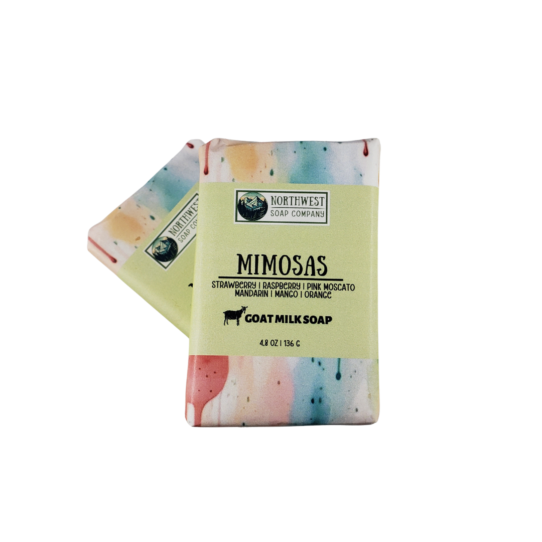 NW Soap Mimosas unwrapped bars of soap in greens, peach, and pinks.