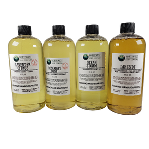NW Soap Company Foaming hand soap refill bottles. Picture of four scents: Lavender Citrus,  Rosemary Mint, Ocean Storm, and Lakeside. 