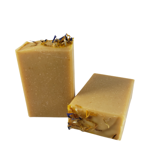 Two unwrapped bars of Lemon, Honey, and Turmeric body bar soap.