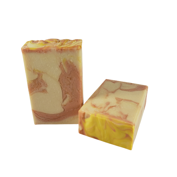 Teo unwrapped bars of Plumeria Blossoms body bar soap made by Northwest Soap Company. 