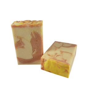 Teo unwrapped bars of Plumeria Blossoms body bar soap made by Northwest Soap Company. 