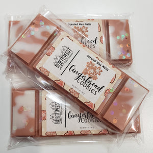 3 Gingerbread Cookie wax melts packaged in their recylable 5 PP wrappers.  Shaped like a candy bar in a ginerbread brown wax  with white drizzle and eco glitter.