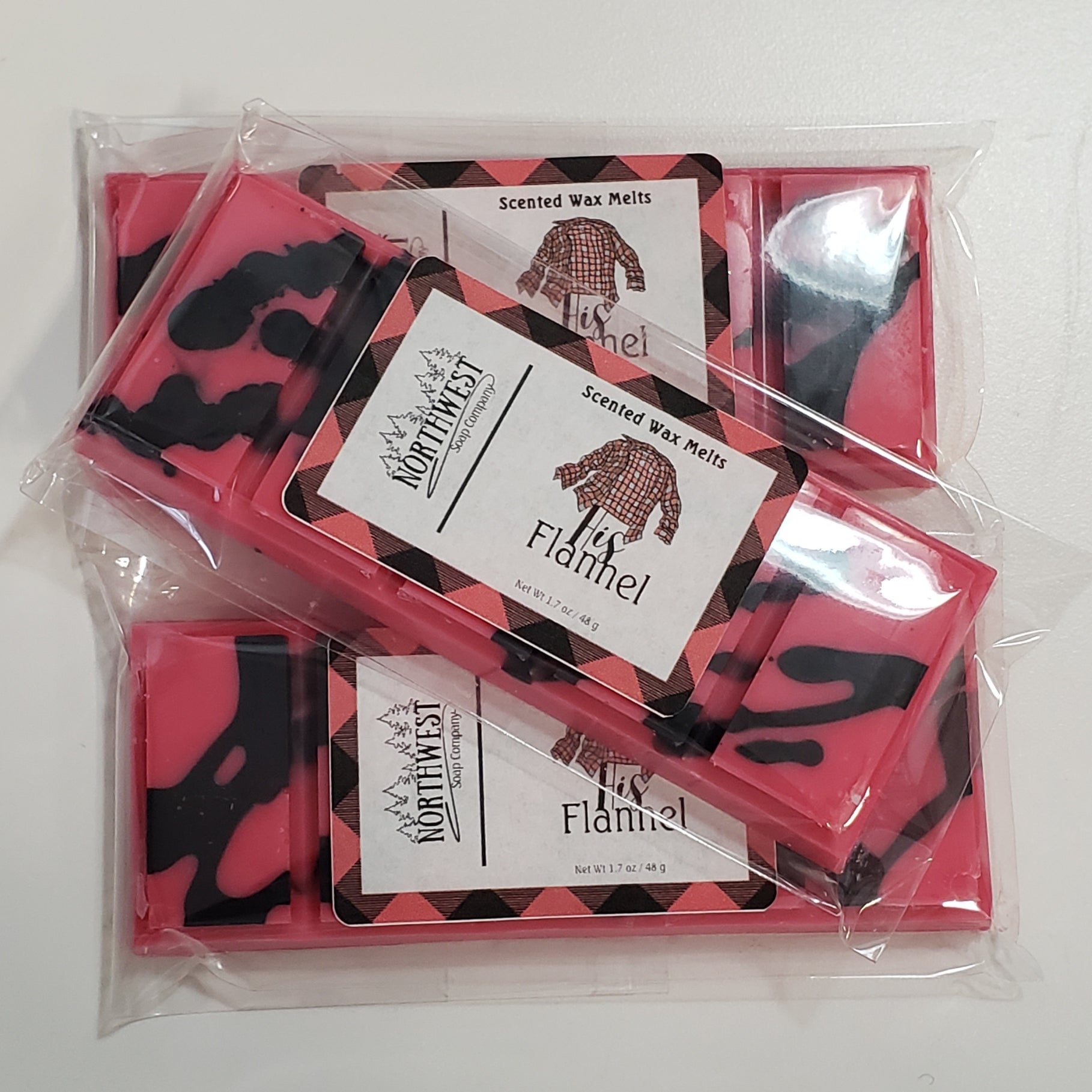 3 His Flannel Wax melts in their recyclable 5 PP wrappers.  Red with black drizzle.