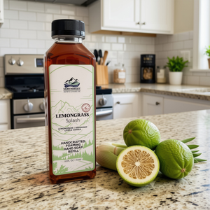 NW Soap Co Lemongrass Splash Foaming Soap Refill in 16 oz square bottle sitting on counter with bergamot and lemongrass next to it.