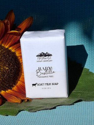 Bar of soap on a sunflower with a blue background