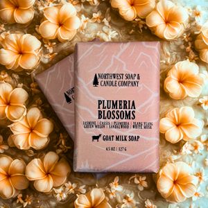 Northwest Soap & Candle Company Plumeria Blossoms soap bar surrounded by plumeria flowers