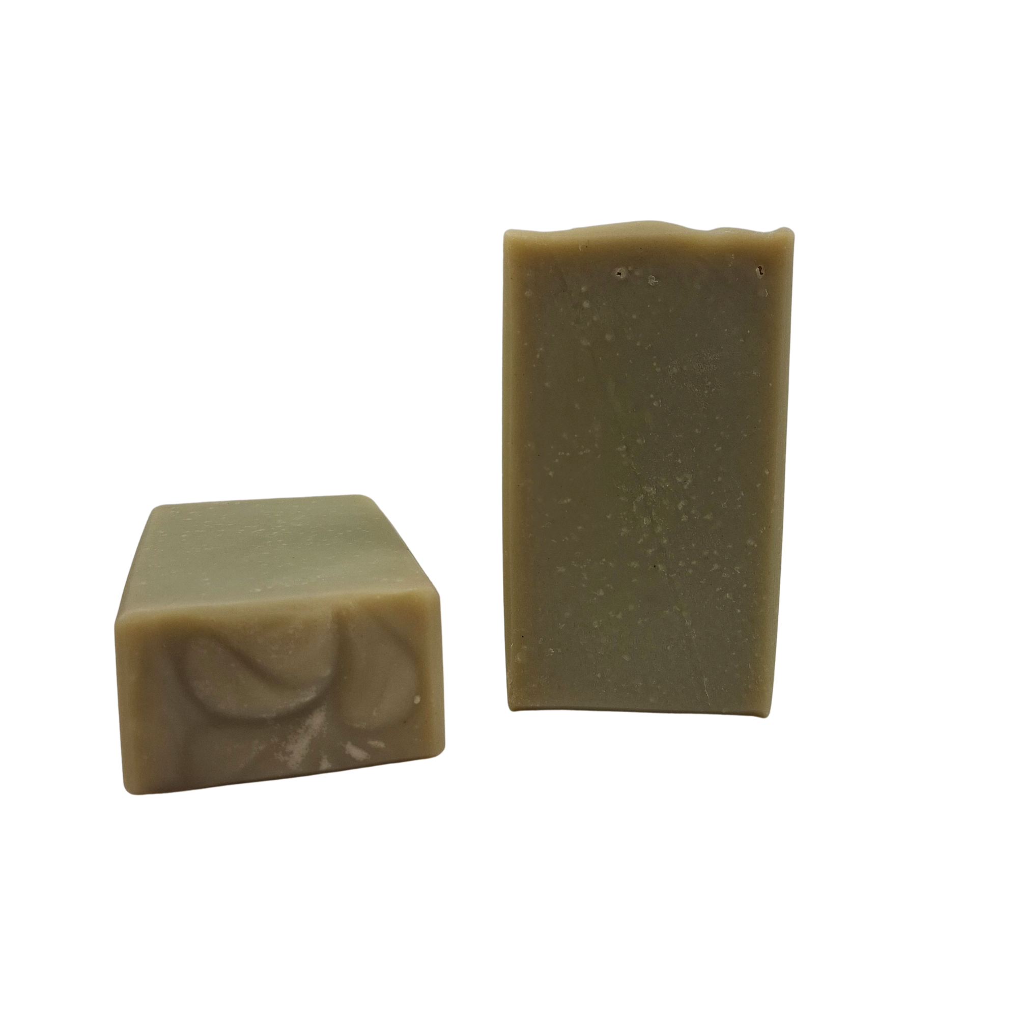Two unwrapped bars of Northwest Soap and Candle company's Rosemary Mint Twist Natural Soap. Green in color.