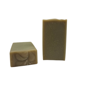 Two unwrapped bars of Northwest Soap and Candle company's Rosemary Mint Twist Natural Soap. Green in color.