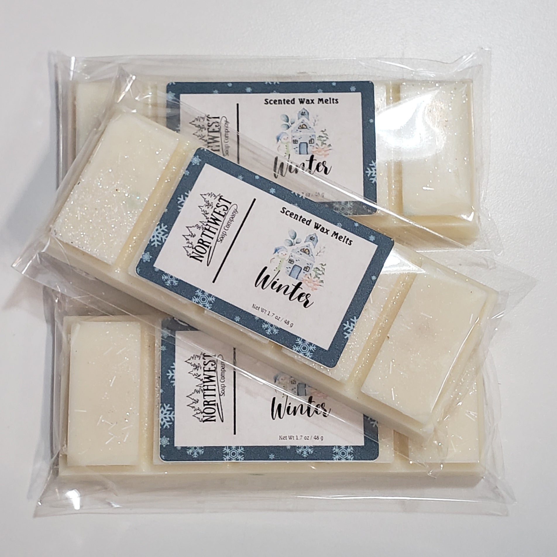 3 Winter Wax melts in their recyclable 5 PP wrappers.  Creamy white wax with silver eco glitter.